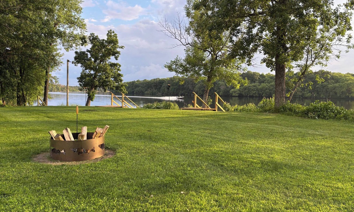 Nekoosa Cottage | Scenic riverfront cottage with boat landing and docks.