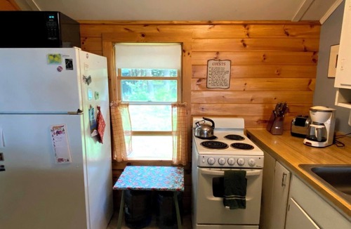 Rome Cabin | Charming lakefront cabin with large screened-in porch and lawn in Rome