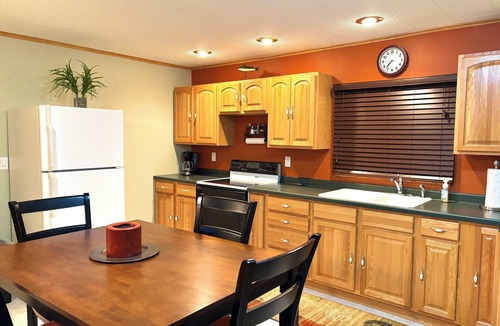 Nekoosa Cottage | Scenic riverfront cottage with boat landing and docks.