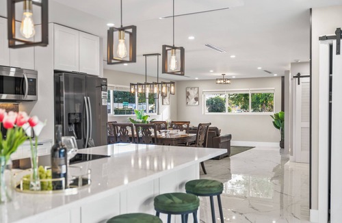 West Palm Beach Villa | Tropical Luxe Oasis with warm Pool,5 bedr 3 bath& Mini Golf, Impact Windows