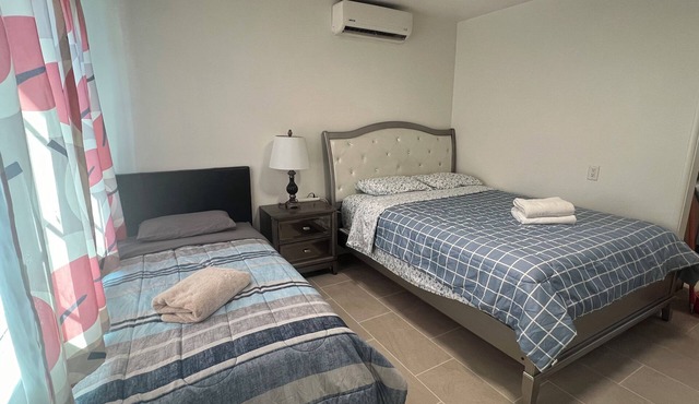 Mini single family house 2 bedrooms 1 bathroom with 3 beds.